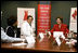 Laura Bush participates in a roundtable with Delphia Daniel, heart disease survivor, and Dr. Paul Colavita, Cardiologist, Sanger Clinic, at Carolinas Medical Center Wednesday, Feb. 15, 2006, in Charlotte, NC, to promote heart disease awareness, education and prevention. Heart disease is the leading cause of death of women in the US.