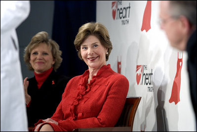 Laura Bush sits with Lois Ingland, a heart disease survivor, during an event at the Carolinas Medical Center Wednesday, Feb. 15, 2006, in Charlotte, NC. Despite having none of the risk factors of heart disease, Lois, a mother of four, suffered a heart attack when she was 36 years old.