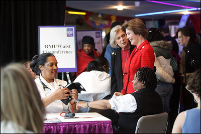 Mrs. Laura Bush is joined by Mrs. Irene Pollin, left, Friday, Feb. 17, 2006, while attending the National Woman's Heart Day Health Fair at the MCI Center in Washington. Mrs. Pollin is the founder and president of Sister to Sister, a national grassroots nonprofit organization offering free heart disease screenings and "heart-healthy" information and support to women to prevent heart disease.