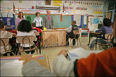 President George W. Bush and Mrs. Laura Bush visit students at North Glen Elementary School in Glen Burnie, Md., Monday, Jan. 9, 2006. "It is a really important piece of legislation that is working. And I'm here today to talk about the spirit of the No Child Left Behind Act, the evidence that says it's working, and my deep desire to work with Congress to make sure it continues to have the desired effect on children all across the country," said the President during his remarks.