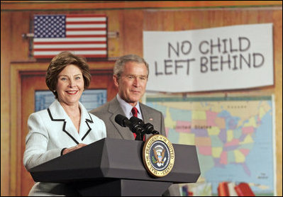 Laura Bush and President Bush discuss "No Child Left Behind," at North Glen Elementary School in Glen Burnie, Md., Monday, Jan. 9, 2006. "Interestingly enough, in 2003, 45 percent of the African American students in this school rated proficient in reading; in 2005, 84 percent are proficient. In other words, this is a school that believes every child can learn. Not just certain children, every child," said the President.