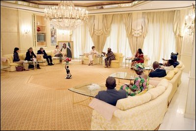 Mrs. Laura Bush is joined by daughter Barbara as they visit with Nigeria President Olusegun Obasanjo Wednesday, Jan. 18, 2006, at the presidential villa in Abuja, Nigeria. The visit came on the last day of a four-day visit to West Africa.