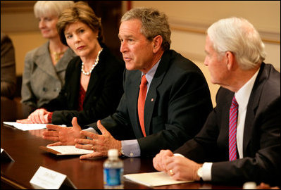 President George W. Bush, with Mrs. Bush, speaks to the press during a meeting with foundations to help aid Gulf coast Recovery at the White House, Thursday, Jan. 19, 2006.