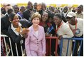 Laura Bush poses with U.S. Embassy workers and their family members, Wednesday, Jan. 18, 2006, during a stop at the U.S. Embassy in Abuja, Nigeria.