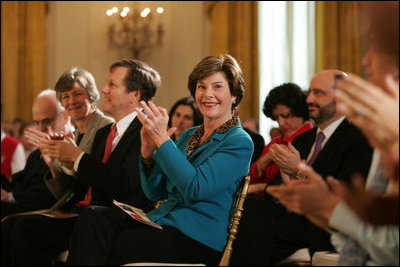 Laura Bush applauds The Moving in the Spirit dancers performance Wednesday, Jan. 25, 2006 in the East Room of the White House, during the President's Committee on the Arts and the Humanities 2006 Coming Up Taller Awards ceremony.