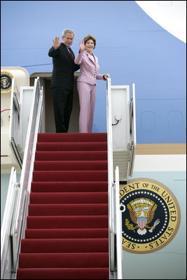 President George W. Bush and Laura Bush wave from Air Force One at Andrews Air Force Base en route to Germany and Russia Wednesday, July 12, 2006. President Bush will meet with Chancellor Angela Merkel in Germany and attend the G8 Summit in St. Petersburg, Russia.