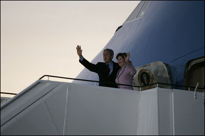 President George W. Bush and Mrs. Laura Bush wave upon arrival of Air Force One to Rostock-Laage Airport in Rostock, Germany on July 12, 2006. The couple is visiting with Germany's Chancellor Angela Merkel before proceeding to Russia for the G8 Summit.
