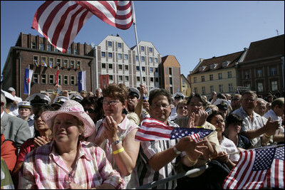 People crowd the town square of Stralsund, Germany, as Chancellor Angela Merkel welcomes President George W. Bush and Laura Bush Thursday, July 13, 2006. "And in 1989, it was also one of the many cities where on Monday demonstrations took place, where people went out into the streets to demand freedom, to demonstrate for freedom," said Chancellor Merkel.