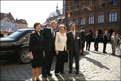 President George W. Bush and Laura Bush participate in an arrival ceremony with German Chancellor Angela Merkel and her husband Joachim Sauer in Stralsund, Germany, Thursday, July 13, 2006.