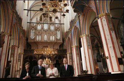 President George W. Bush and Laura Bush stand with German Chancellor Angela Merkel and Pastor Peter Neumann in St. Nikolai Church in Stralsund, Germany, Thursday, July 13, 2006.