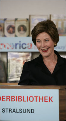 Mrs. Laura Bush speaks to school children during a visit Thursday, July 13, 2006, to the Stralsund Children's Library in Stralsund, Germany, where Mrs. Bush participated in the ribbon cutting to open the exhibit America@yourlibrary. The America@yourlibrary is a new initiative to develop existing and new partnerships between German public libraries and the U.S. Embassy and Consulate Resource Centers.