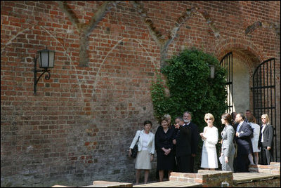 Mrs. Laura Bush is escorted on a tour outside the City of Stralsund Archives in Stralsund, Germany, Thursday, July 13, 2006, by Dr. Hans-Joachim Hacker, director of the City of Stralsund Archives.
