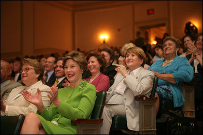 Mrs. Laura Bush applauds the speakers participating in the National Endowment for the Arts Big Read event Thursday, July 20, 2006, at the Library of Congress in Washington. The Big Read is a new program to encourage the reading of classic literature by young readers and adults.