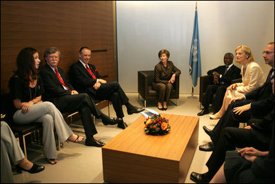 Ms. Barbara Bush talks about her experiences visiting AIDS clinics in Africa with U.S. Ambassador to the U.N. John Bolton, seated at her left, UN Secretary-General Kofi Annan, seated next to Mrs. Bush, and staff members during a visit to the United Nations in New York June 2, 2006. Mrs. Laura Bush also spoke about HIV/AIDS to the United Nations General Assembly's High-Level Meeting on AIDS.