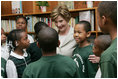 Mrs. Laura Bush meets with students during her visit to Our Lady of Perpetual Help School in Washington, Monday, June 5, 2006, where she announced a Laura Bush Foundation for America's Libraries grant to the school.