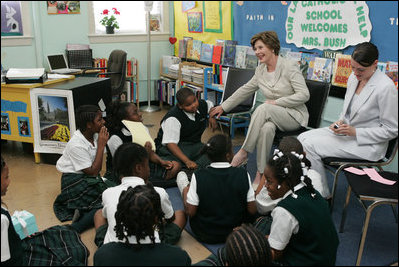 Mrs. Laura Bush talks with students during her visit to Our Lady of Perpetual Help School in Washington, Monday, June 5, 2006, where she announced a Laura Bush Foundation for America's Libraries grant to the school. Mrs. Bush is joined by Our Lady of Perpetual Help fifth grade teacher Julie Sweetland, right. 