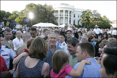 President George W. Bush welcomes guests to the annual Congressional Picnic on the South Lawn of the White House Wednesday evening, June 15, 2006, hosting members of Congress and their families to a "Rodeo" theme picnic.