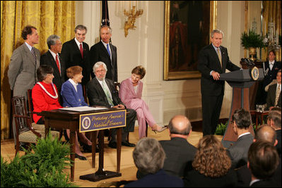President George W. Bush addresses invited guests in the East Room of the White House prior to signing a proclamation to create the Northwestern Hawaiian Islands Marine National Monument, Wednesday, June 15, 2006.The proclamation will bring nearly 140,000 square miles of the Northwestern Hawaiian Island Coral Reef Ecosystem under the nation's highest form of marine environmental protection. Mrs. Laura Bush joined the President and distinguished guests on stage, seated from left to right, Hawaii Gov. Linda Lingle; marine biologist Sylvia Earle; and documentary filmmaker Jean-Michel Cousteau, Standing ,left to right, are U.S. Rep. Ed Case, D-Hawaii; U.S. Sen. Daniel Akaka, D-Hawaii; U.S. Commerce Secretary Carlos Gutierrez and U.S. Interior Secretary Dirk Kempthorne.