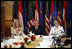 President George W. Bush and Laura Bush are joined by U.S. Ambassador to Austria Susan McCaw during a roundtable discussion Wednesday, June 21, 2006, with foreign students at the National Library in Vienna.