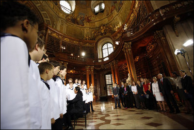 President George W. Bush and Mrs. Laura Bush listen to the Vienna Boys Choir at the National Library at Hofburg Palace in Vienna, June 21, 2006.