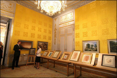 Mrs. Laura Bush is given a tour of one of the gallery rooms at the Albertina Museum in Vienna, Austria, Wednesday, June 21, 2006, by Dr. Klaus Schroeder, director of the museum.