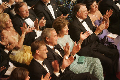 President George W. Bush and Mrs. Laura Bush join the audience in applauding the entertainment Sunday evening, June 25, 2006, at the annual Ford's Theatre gala to benefit the historic theater. The program, "An American Celebration at Ford's Theatre," will be televised on July 4, 2006.