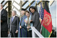 First Lady Laura Bush waves as she stands with President George W. Bush, President Hamid Karzai of Afghanistan, and Secretary of State Condoleezza Rice during welcoming ceremonies Wednesday, March 1, 2006, in Kabul.