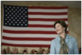 Mrs. Laura Bush appears before an audience of U.S. and Coalition troops, Wednesday, March 1, 2006, during a visit to Bagram Air Base in Afghanistan, where President George W. Bush thanked the troops for their service in defense of freedom.
