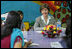 Laura Bush listens to a question during an informal group discussing during a visit to Prayas, a home for abused children in Tughlaqabad, New Delhi, India March 2, 2006.
