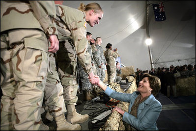 Mrs. Laura Bush greets U.S. and Coalition troops Wednesday, March 1, 2006, during a stopover at Bagram Air Base in Afghanistan, prior to the President and Mrs. Bush visiting India and Pakistan.