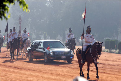 With mounted escorted, a limousine carrying the President and Mrs. Bush, head to Rashtrapati Bhavan, the official residence of the President of India in New Delhi, Thursday, March 2, 2006.