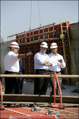 President George W. Bush and New Orleans Mayor Ray Nagin, right, view flood wall construction in the Industrial Levee Canal, Wednesday, March 8, 2006 in New Orleans, during a tour to view the clean up and reconstruction progress of New Orleans six-months after the city was devastated by Hurricane Katrina.