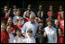 President George W. Bush and Laura Bush pose with students at the College Park Elementary School in Gautier, Miss., Wednesday, March 8, 2006, where Mrs. Bush announced the establishment of The Gulf Coast School Library Recovery Initiative, to help Gulf Coast schools that were damaged by the hurricanes rebuild their book and material collections. The initiative was established by the Laura Bush Foundation for American Libraries.