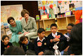 Mrs. Laura Bush listens to a student answer a question as she attends a class lesson in the Children's Resources International clasroom at the U.S. Embassy , Saturday, March 4, 2006 in Islamabad, Pakistan.