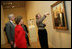 Mrs. Laura Bush listens Thursday evening, March 9, 2006 to Jane Milosch, curator of the Smithsonian American Art Museum's Renwick Gallery in Washington, as Mrs. Bush is shown the famous Grant Wood painting "American Gothic," during a tour of the Renwick Gallery exhibit, "Grant Wood's Studio: Birthplace of American Gothic," scheduled to open Friday, March 10, 2006. Mrs. Bush is accompanied on the tour by Ned. L. Rifkin, under secretary of art at the Smithsonian Institution.