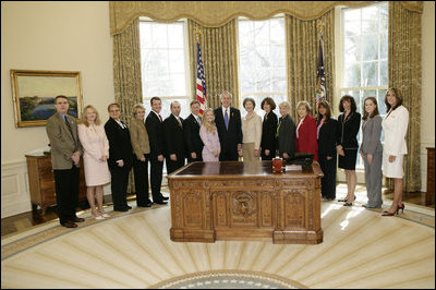 President George W. Bush and Mrs. Laura Bush meet Friday, March 10, 2006 in the Oval Office of the White House, with representatives from various organizations honored for their support the U.S. military.