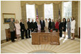 President George W. Bush and Mrs. Laura Bush meet Friday, March 10, 2006 in the Oval Office of the White House, with representatives from various organizations honored for their support the U.S. military.