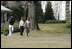 Mrs. Laura Bush takes a brisk walk with Barbara Harrison of WRC-TV (NBC 4) around the South Grounds of the White House Friday, March 10, 2006, during an interview given by Mrs. Harrison. The focus of the interview is to promote exercise and health awareness.