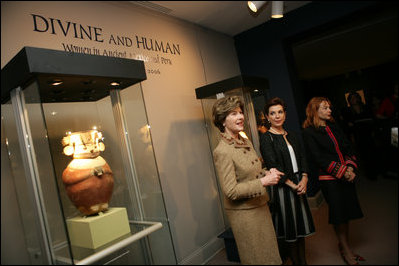 Mrs. Laura Bush, accompanied by Mrs. Marta Sahagun de Fox and Mrs. Eliane Karp de Toledo, talks with reporters following her tour of the Divine and Human: Women in Mexico and Peru Exhibit, Tuesday, March 14, 2006 at The National Museum of Women in the Arts in Washington.