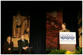 Mrs. Laura Bush addresses an audience Tuesday, March 14, 2006 at the National League of Cities Conference in Washington, asking for their communities continued support of the Helping America's Youth initiative.
