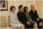 Mrs. Laura Bush attends the Afghan Children's Initiative Benefit Dinner at the Afghanistan Embassy in Washington, DC on Thursday evening, March 16, 2006. Seated with Mrs. Bush are Dr. Khaled Hosseini, author of The Kite Runner; Mrs. Shamim Jawad, host and wife of the Afghan Ambassador to the U.S.; and Mr. Tim McBride, member of the U.S.-Afghan Women's Council.
