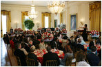 President George W. Bush and Mrs. Laura Bush join invited guests in listening to vocal star Denyce Graves at a White House social luncheon in honor of Liberia's President Ellen Johnson Sirleaf, Tuesday, March 21, 2006, at the White House.
