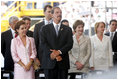 Laura Bush stands next to President Vicente Fox and his wife Marta Sahagun de Fox of Mexico during the inaugural ceremony of President Oscar Arias at the Estadio Nacional in San Jose, Costa Rica, Monday, May 8, 2006.