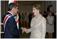 After the inauguration ceremony, Mrs. Laura Bush greets President Oscar in San Jose, Costa Rica, Monday, May 8, 2006. "Today I had the opportunity to convey to President Arias the United States' strong support and partnership with Costa Rica," said Mrs. Bush in a statement to the press. "We have a history of a long friendship, and I'm very, very happy to have been the one to get to give him the very best wishes of the American people."
