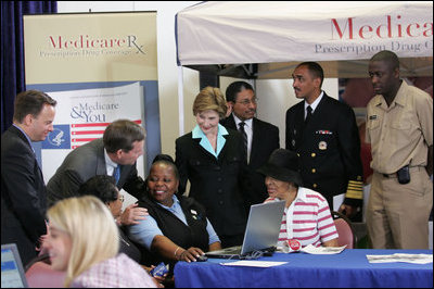 Mrs. Laura Bush meets with senior citizens during the last day of enrollment for the new Medicare prescription drug benefit at Shiloh Baptist Church in Washington, D.C., Monday, May 15, 2006. Talking with senior citizens with Mrs. Bush is Dr. Mark McClellan, Administrator, Centers of Medicare and Medicaid, and Secretary Mike Leavitt, Department of Health and Human Services.