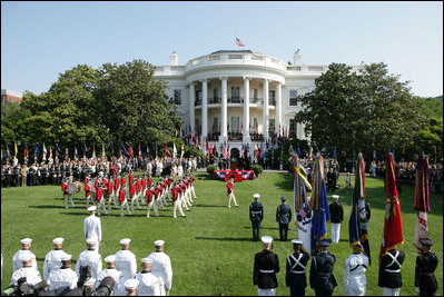 President George W. Bush and Australian Prime Minister John Howard inspect The Old Guard Fife and Drum Corps during the State Arrival Ceremony held for the Prime Minister on the South Lawn Tuesday, May 16, 2006.