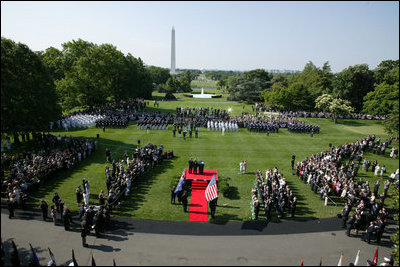 President George W. Bush and Australian Prime Minister John Howard stand for the playing of their respective country's National Anthems during the State Arrival Ceremony held for the Prime Minister on the South Lawn Tuesday, May 16, 2006.