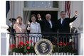 President George W. Bush, Prime Minister John Howard, Mrs. Laura Bush and Mrs. Janette Howard wave from the South Portico of the White House during the State Arrival Ceremony on the South Lawn Tuesday, May 16, 2006.