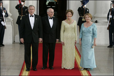 President George W. Bush, Prime Minister John Howard, Mrs. Laura Bush and Mrs. Janette Howard arrive at the White House for a State Dinner May 16, 2006.