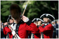 The Old Guard Fife and Drum Corps marches past President George W. Bush and Australian Prime Minister John Howard during a State Arrival Ceremony May 16, 2006 at The White House.